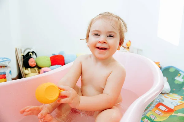 Kid Sitting Tub Bathroom Holding Toy Cup Front View Looking — Foto de Stock