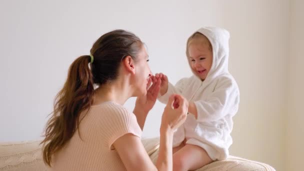 Sitting Sofa Young Mother Cheerfully Plays Child Bathrobe Dance Hands — Video Stock