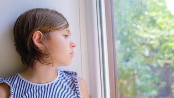 Sad Child Girl Short Hair Sits Window Profile Looks Street — Vídeo de Stock