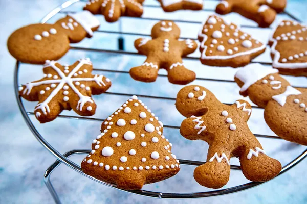 Christmas homemade gingerbread cookies on blue background — Stock Photo, Image