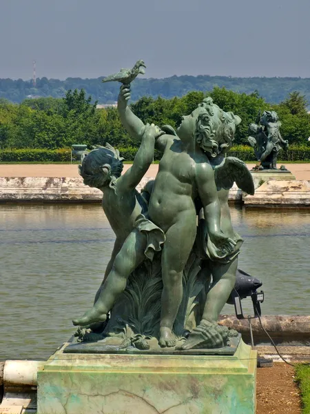 Sculptures and pond of Royal residence at Versailles near Paris in France — Stock Photo, Image