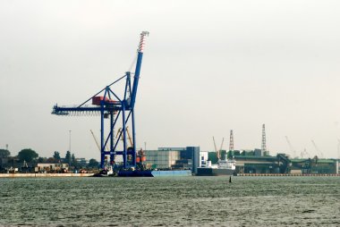 Klaipeda harbour with cranes. Lithuania  clipart