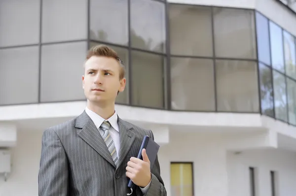 Businessman holds the notebook — Stock Photo, Image