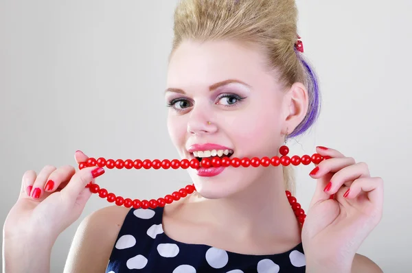 Woman beating red chaplet — Stock Photo, Image