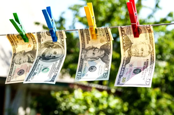 Paper dollars are drying on rope — Stock Photo, Image