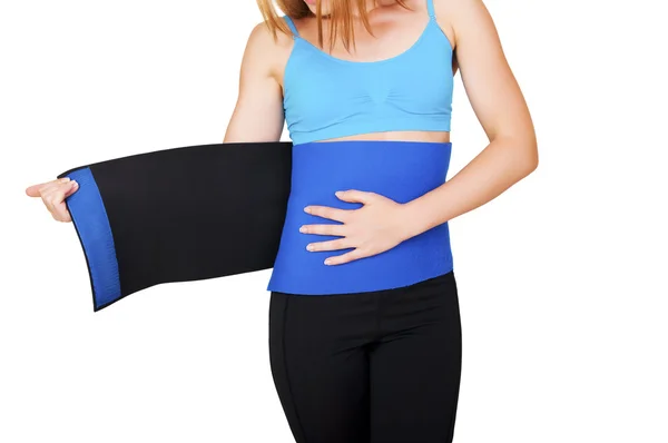 Fit woman with belt for weight loss isolated over white background — Stock Photo, Image