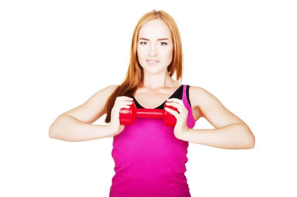 Young fit woman lifting dumbbells on white background — Stock Photo, Image