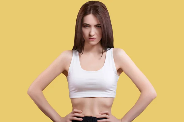 Portrait Attractive Coquettish Cute Angry Girl White Top Yellow Background — Zdjęcie stockowe