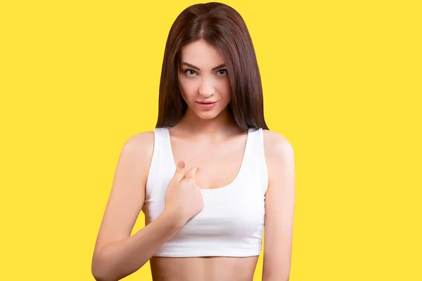 Portrait Cute Girl Pointing Her Finger Herself White Top Yellow — 图库照片