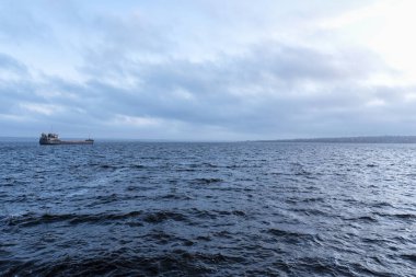 Shipping transportation and logistic commerce industry. Export on sea with cloudy sky background. Cargo