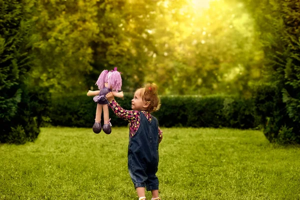 Cute Little Girl Playing Her Favorite Doll Outdoors Summer Park — Photo