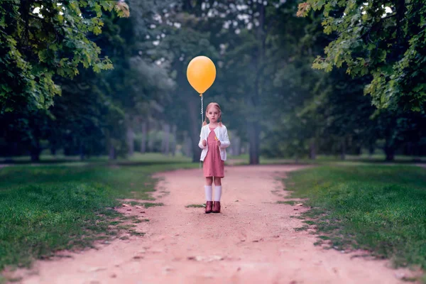 Little Girl Pigtails Yellow Balloon Her Hands Dark Fores — Stock Photo, Image