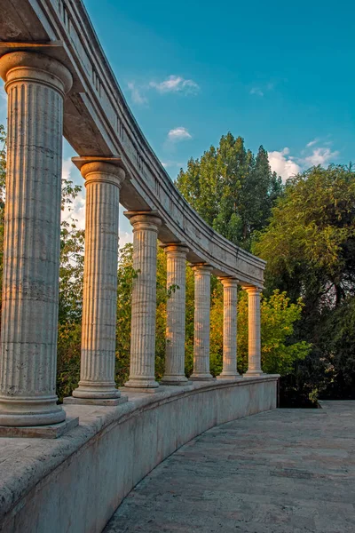 Stone Ancient Colonnade Blue Sky Green Forest Illuminated Sunset Light — Photo