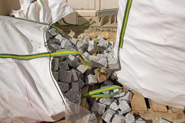 Bags of granite blocks, paved for the road — Stock Photo, Image