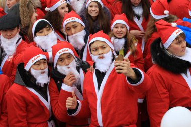 Parade of Santa Clauses in the center of Almaty in honor of the New Year, Kazakhstan 26.12.2015.