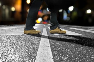 Man crossing street at night clipart