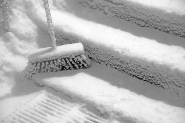 Broom in snow — Stock Photo, Image