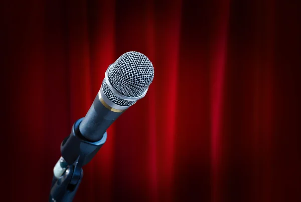 Microphoneon red curtain — Stock Photo, Image