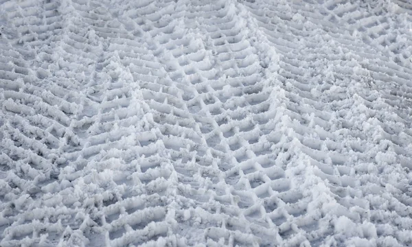 Tire tracks in snow — Stock Photo, Image