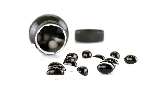 Black and white pills — Stock Photo, Image