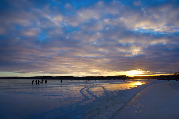 Ice skating at sunset — Stock Photo, Image