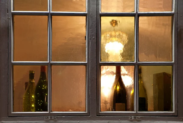 Window with wine bottles — Stock Photo, Image