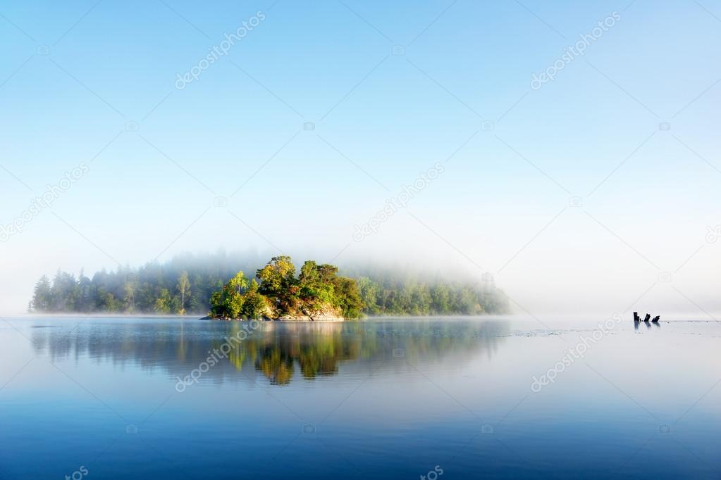 Island on foggy morning