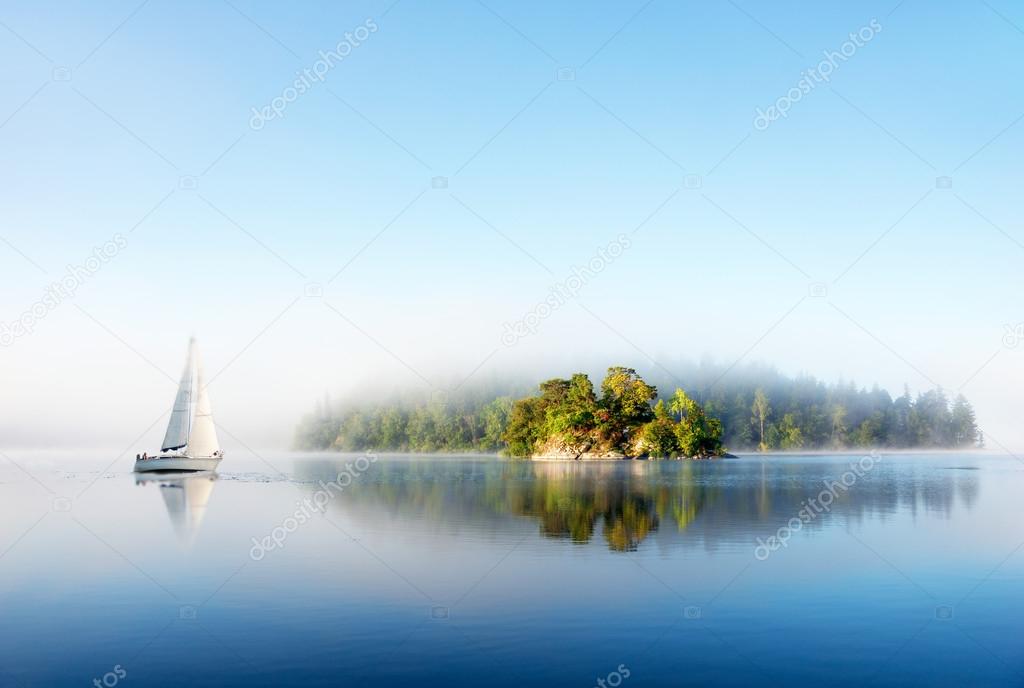 Island on foggy morning