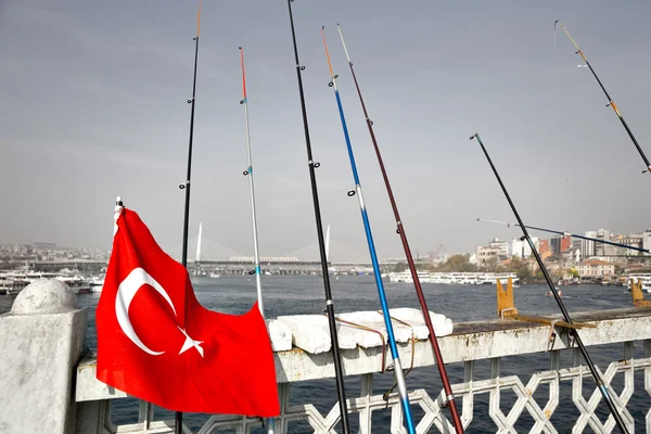 Fishing rods and flag — Stock Photo, Image