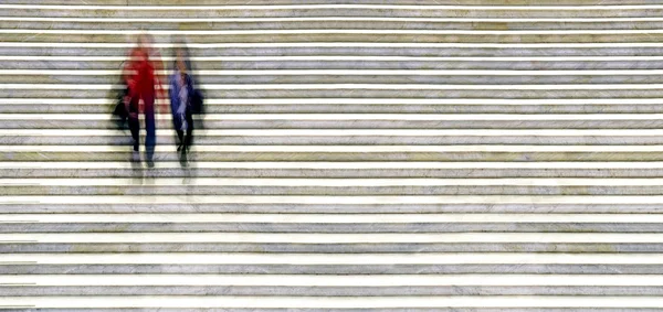 Blurred people in staircase — Stock Photo, Image