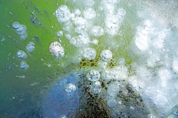 Burbujas de aire en hielo colorido —  Fotos de Stock