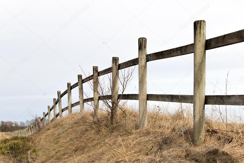 wooden fence in rural landscape