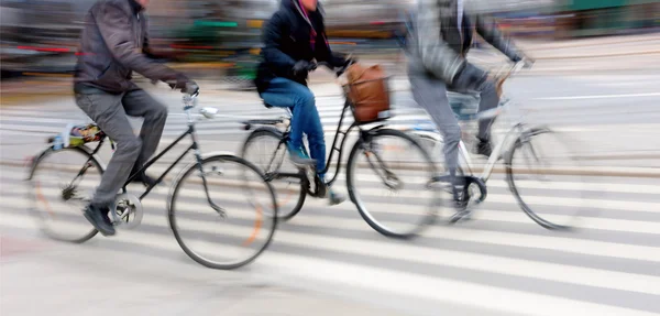 Três ciclistas — Fotografia de Stock