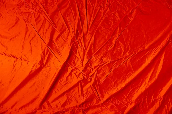 带折皱湿橙色帆布的背景 — 图库照片