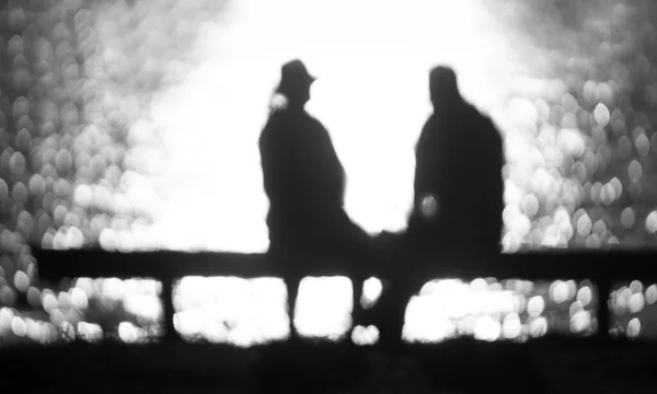 Silhouettes Romantic Back Lit Elderly Couple Bench — Zdjęcie stockowe