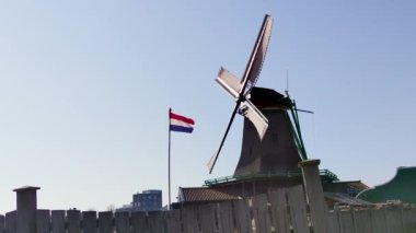 old Dutch windmills of Zaanse Schans with flag