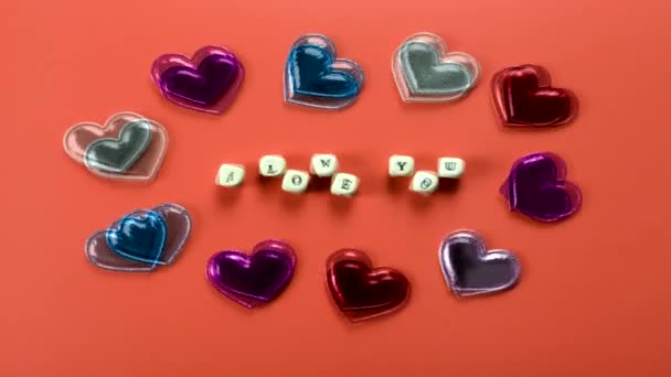 Animated Stop Motion Inscription Cubes Love You Animated Hearts Pink — Stock Video