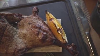 Grilled duck leg with orange slice. Restaurant supply. Videos close up. High quality HD footage