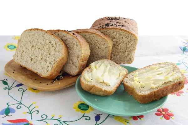 Pão caseiro integral com manteiga — Fotografia de Stock