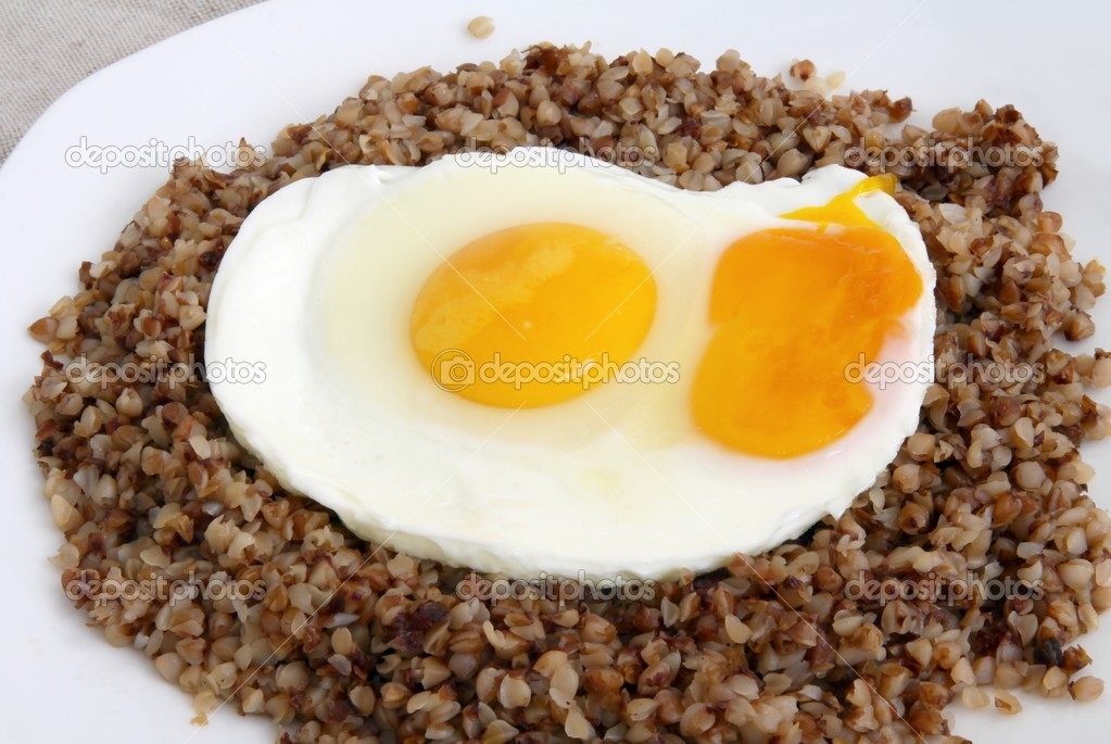 Roasted eggs on portion of buckwheat gruels as vegetarian meal