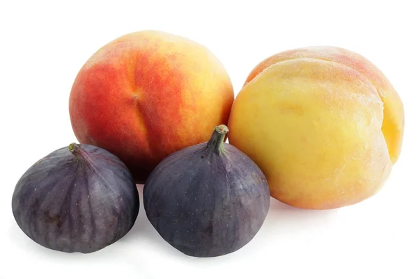 Gold juicy peaches and lila sweet figs — Stock Photo, Image