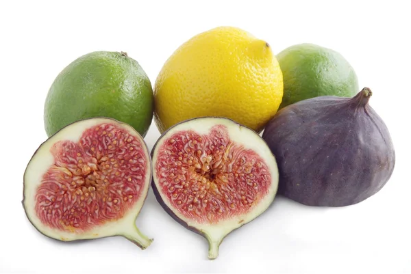 Citrus fruits and lila figs — Stock Photo, Image