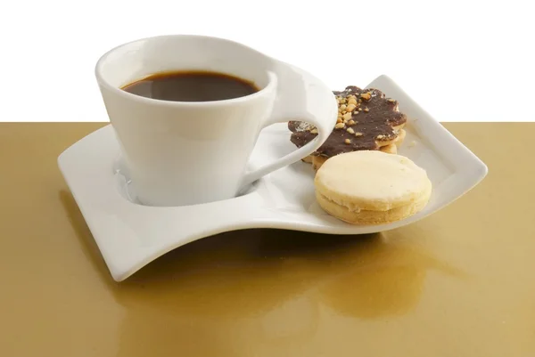 Taza de café caliente y pasteles — Foto de Stock