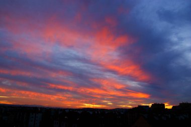 red and pink colours of sky during sunset