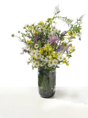 multicolor various wild flowers from meadow in summer