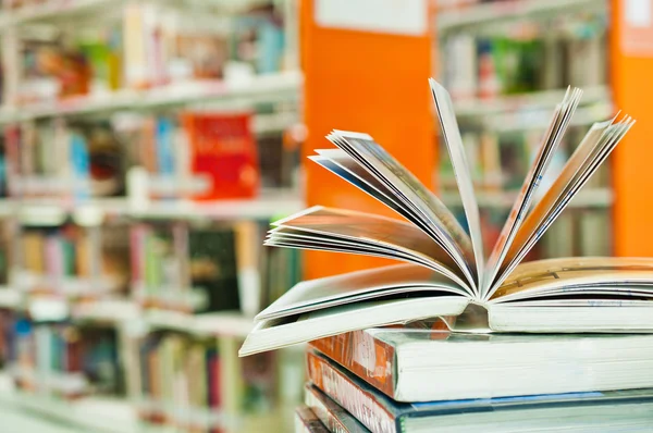 Opened book in library close up — Stock Photo, Image