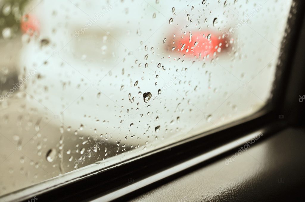 Close up of water drops after rain at the car window