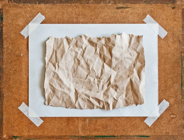 Empty brown Crumpled paper on Particle board background — Stock Photo, Image