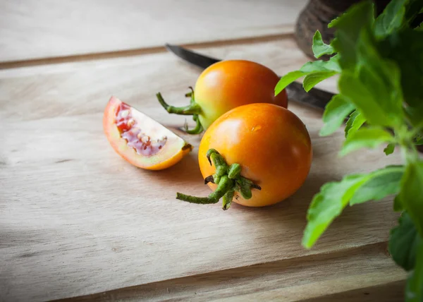 Tomatoes slice on wood — Stock Photo, Image