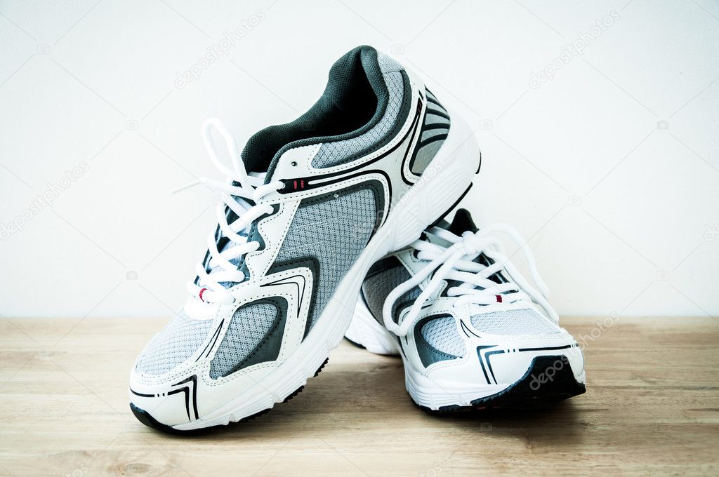 Sports shoes on a wooden floor